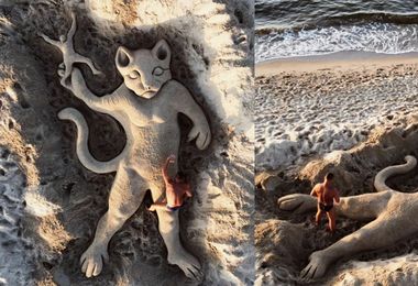 Il gatto che lancia l'uomo: virale la scultura in sabbia di Nicola Urru